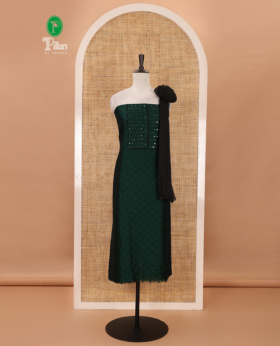 Green material chudidar set, black beads & mirror neck embroidered with buttas woven vichitra silk top, santoon bottom & contrast mirror work chiffon dupatta