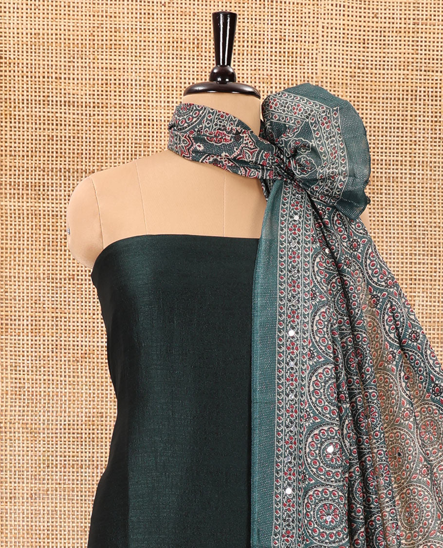Bottle green material chudidar set, plain Vichitra silk top, santoon bottom, and dupatta of Ajrakh print and mirror work