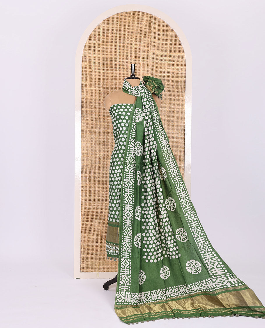 Green material chudidar set, polka dots batik printed modal chanderi top, batik motifs printed bottom, and a batik motifs printed modal chanderi dupatta