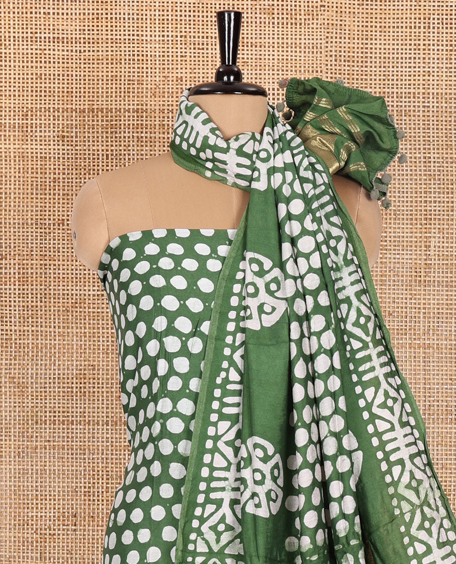 Green material chudidar set, polka dots batik printed modal chanderi top, batik motifs printed bottom, and a batik motifs printed modal chanderi dupatta