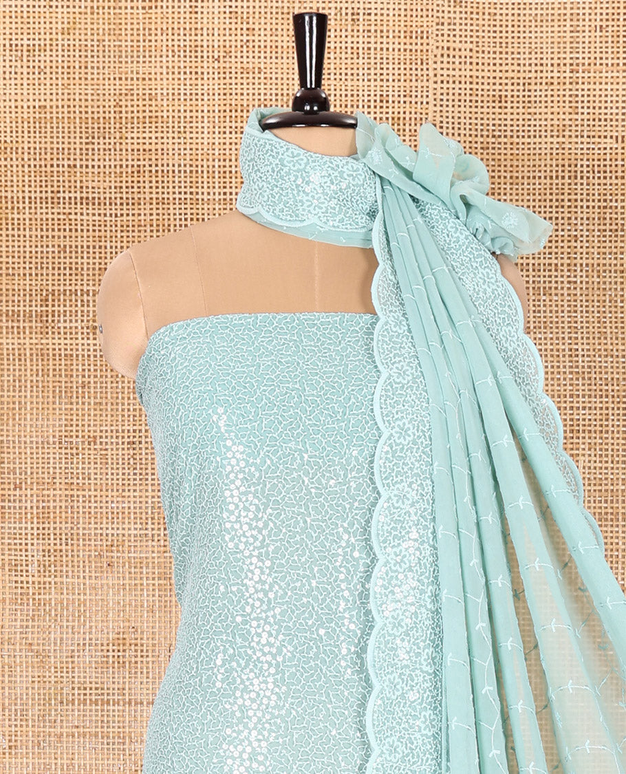 Blue Material Chudidar Set Features Sequin Embroidered Georgette Top, a Plain American Crepe Bottom, and a Scallop Dupatta Embellished with Floral Vine Embroidery