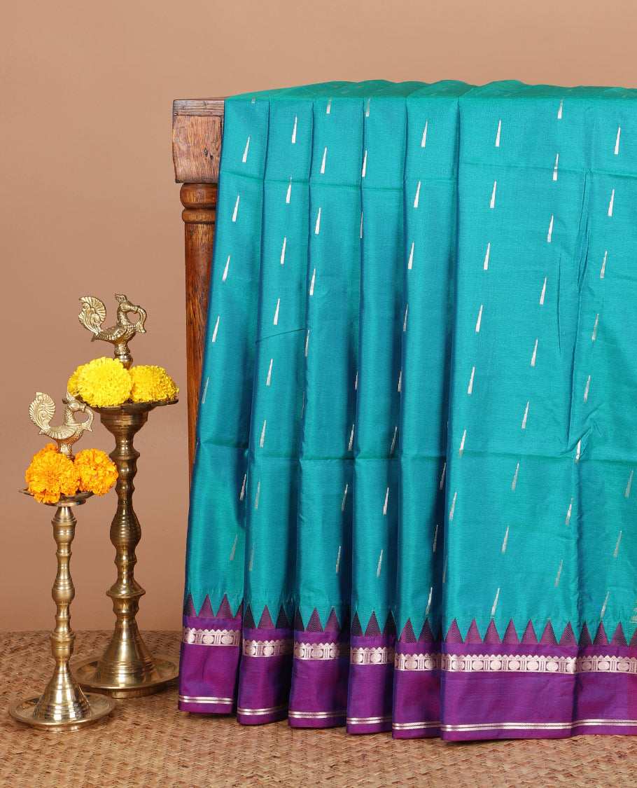 Blue zari butta semi soft silk saree with rettai pettu, temple border grand pallu along with plain blouse