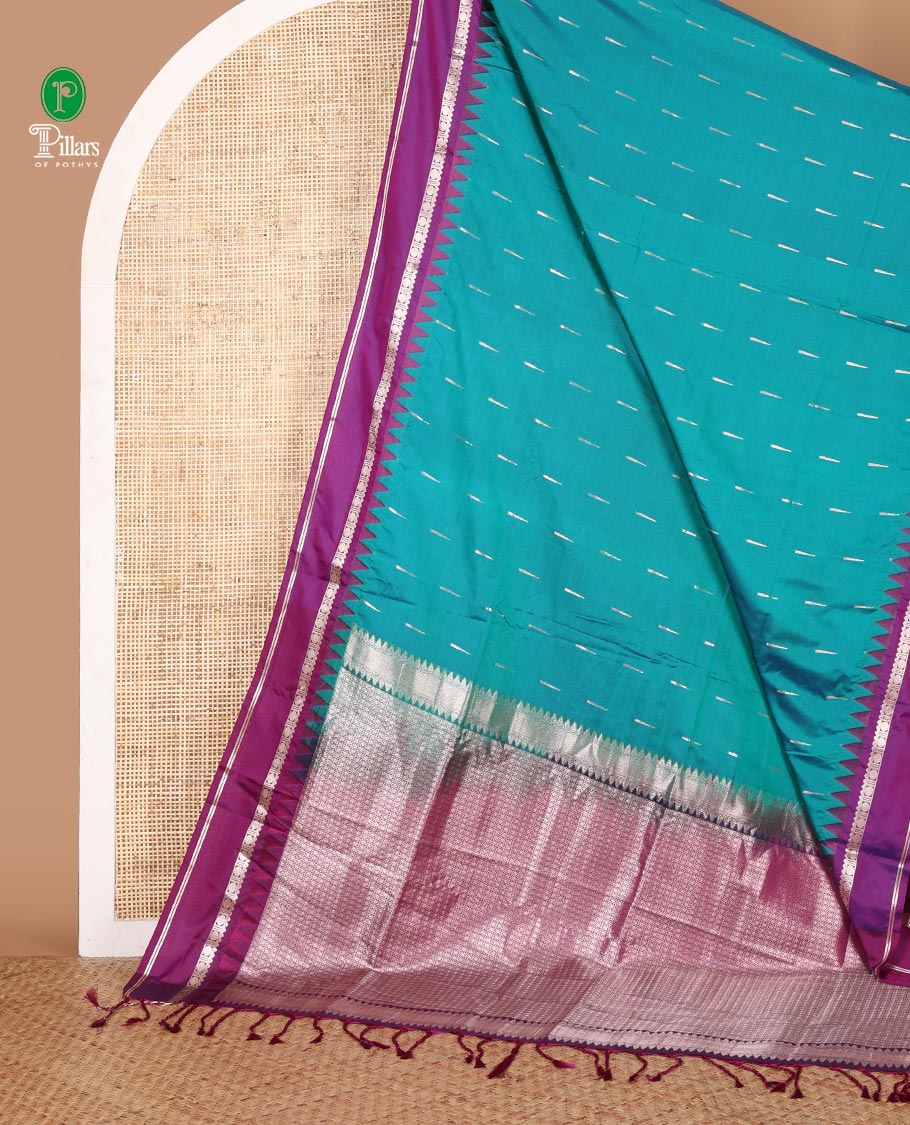 Blue zari butta semi soft silk saree with rettai pettu, temple border grand pallu along with plain blouse