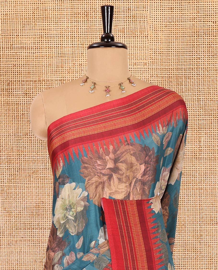 Teal blue floral printed Italian crepe saree, contrast temple printed border, striped pallu, and a printed bordered blouse