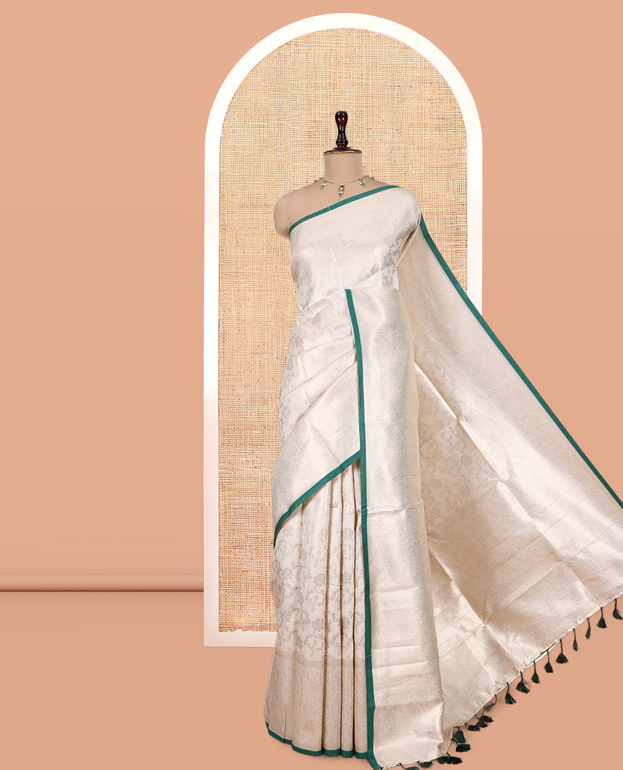 Off-White-Leaf Green Semi-Silk Saree, Adorned with Floral Jacquard Design, a Zari Paisley Border, and a Contrast Blouse