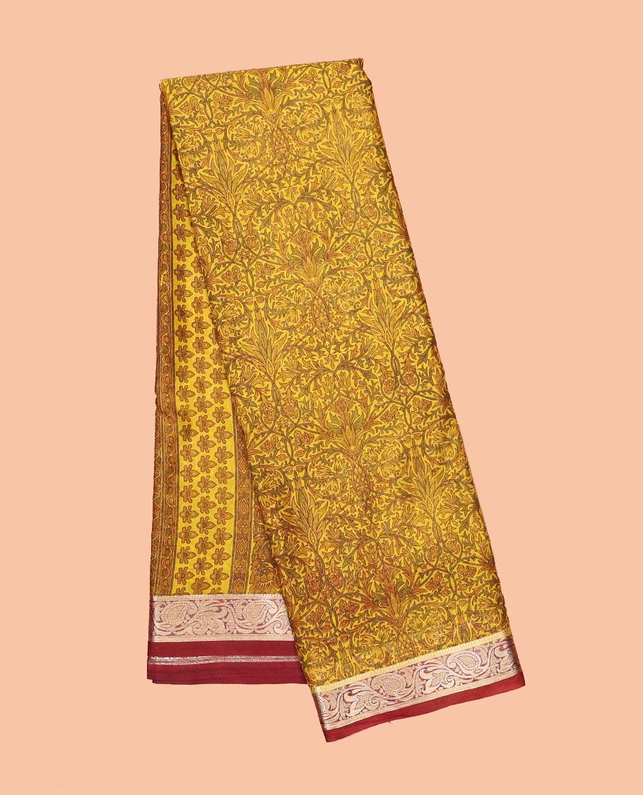 Mustard intricately printed semi-banaras printed saree, contrast floral & paisley border & floral design pallu
