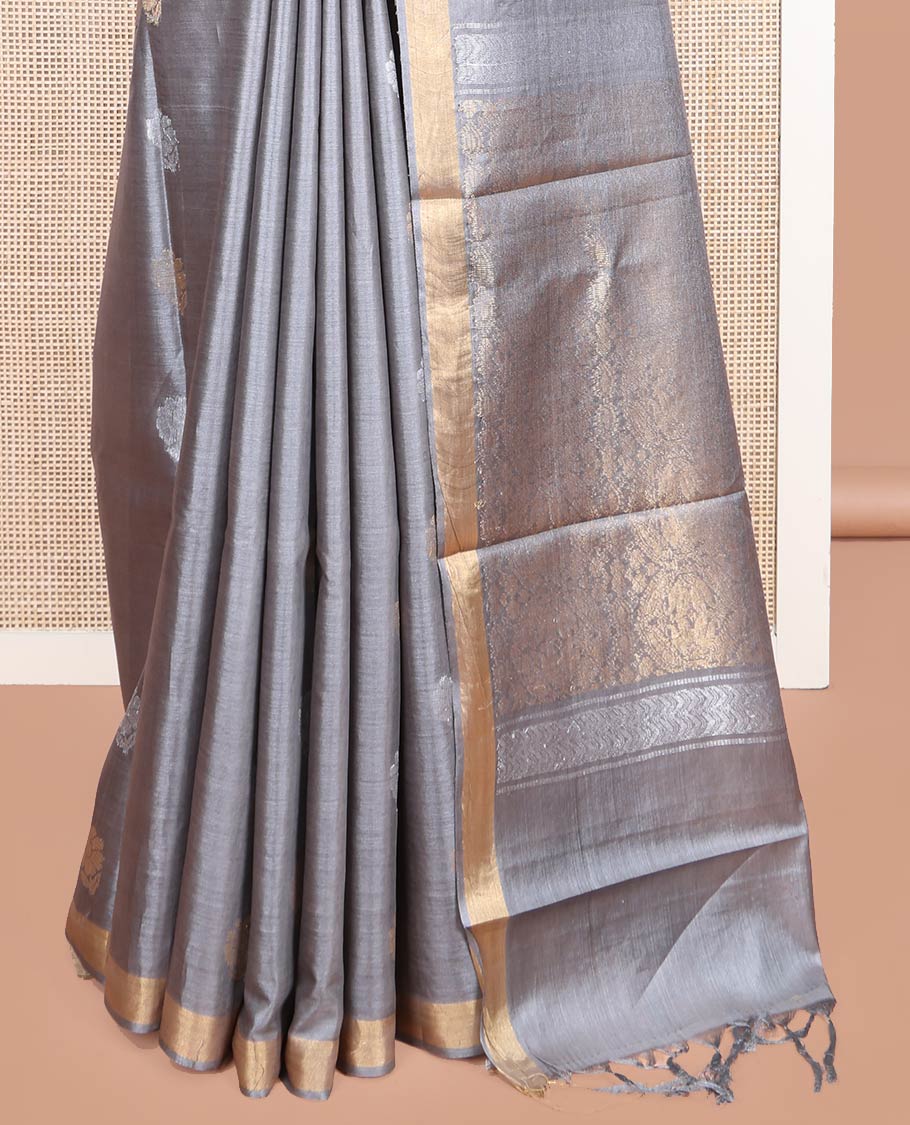 Grey Tussar Silk Saree, Sparsely Woven with Zari Buttas on Its Body, Subtly Woven Bavanji Border, Intricately Zari-Designed Pallu, and Paired with a Matching Blouse