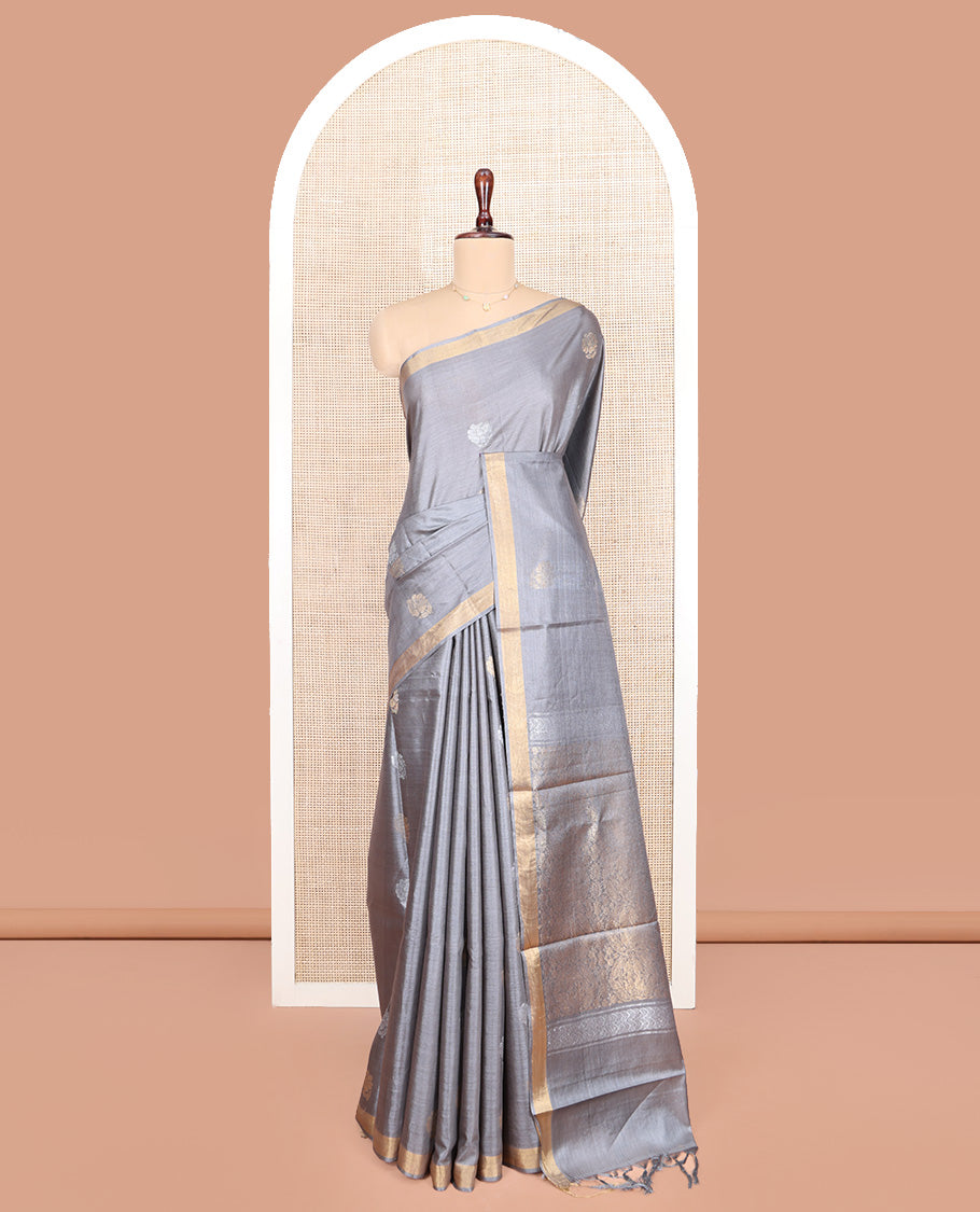 Grey Tussar Silk Saree, Sparsely Woven with Zari Buttas on Its Body, Subtly Woven Bavanji Border, Intricately Zari-Designed Pallu, and Paired with a Matching Blouse