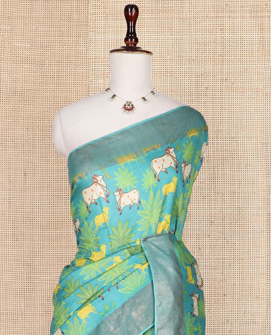 Blue tree and Pichwai cow printed tussar silk saree, bavanji border, and checked pallu