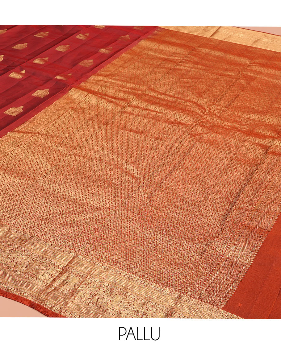 Maroon Vasundhara Lite-Silk Mix Saree, Detailed with Zari Buttas All Over Its Body, Highlighted by a Zari Border of Rekku, Kamalam, Kuyil Kann, Yaanai, and Mayil Designs, Grand Pallu of Jaal Designs, and Paired with a Contrast Blouse
