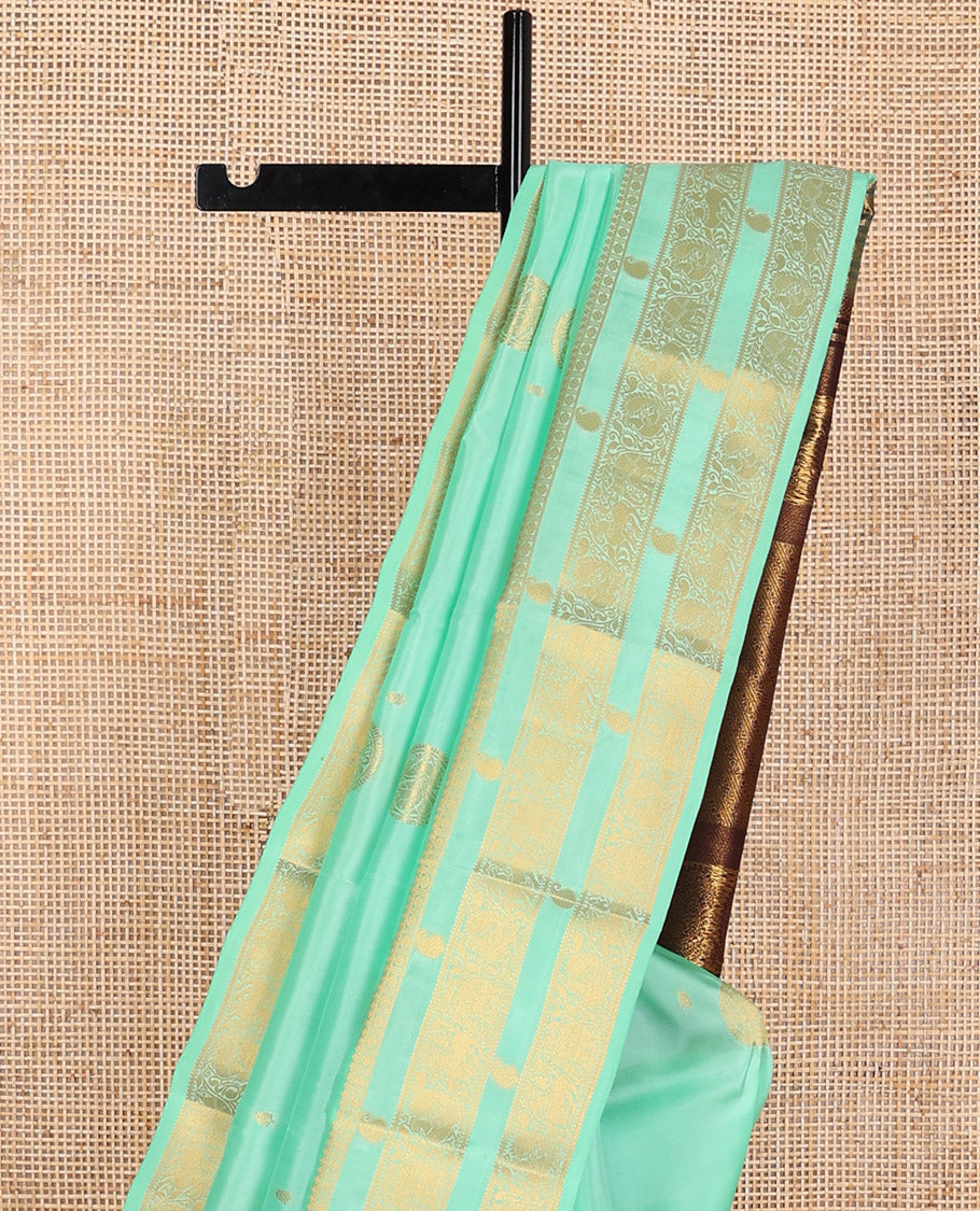 Sea green buttas vasundhara elite silk saree with self zari design border & floral design pallu