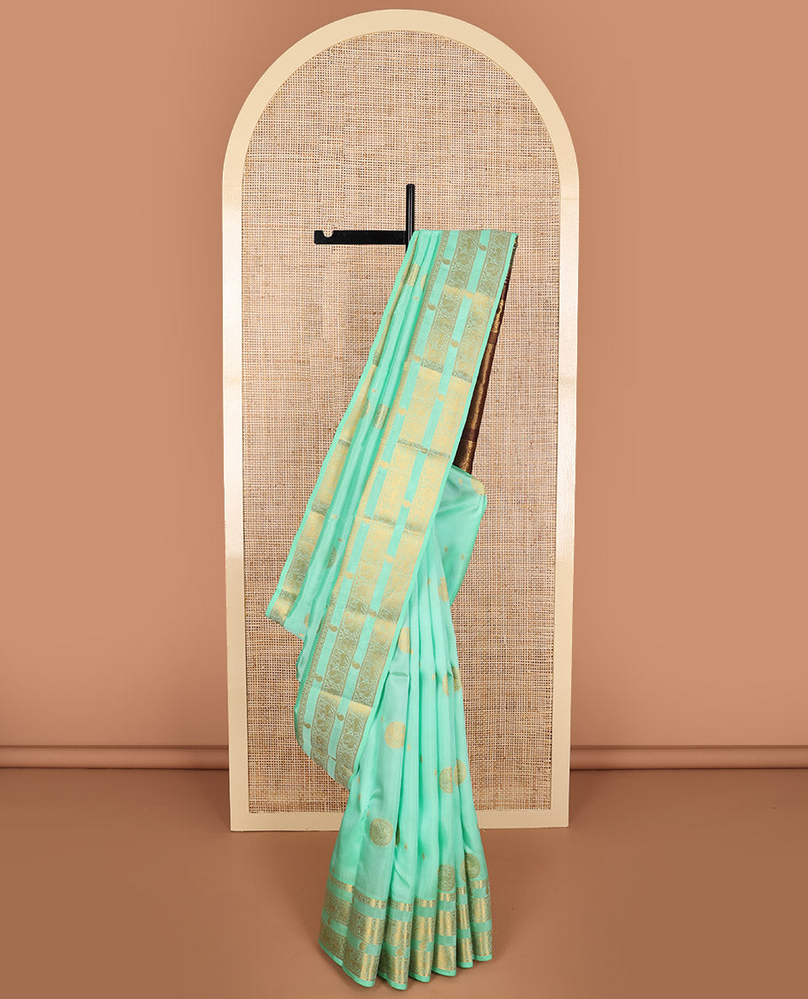 Sea green buttas vasundhara elite silk saree with self zari design border & floral design pallu