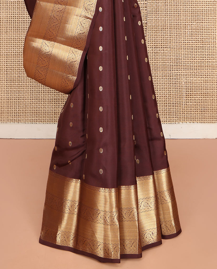 Brown Vasundhara Lite Silk Mix Saree, Decked Up with Zari Buttas All Over Its Body, Highlighted by a Zari Border of Salngai, Muthu, Dhavana Kodi, and Mayil Kann Designs, Pallu of Leaf Vine Designs, and Paired with a Matching Blouse
