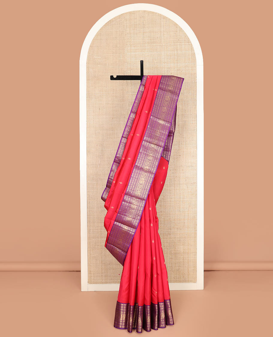 Red Vasundhara Silk Saree Adorned with Zari Buttas, Complemented by a Contrast Border of Thilakam Mokku, Banaras, Rudraksham, Kathir, Cross Neli, and Anna Chakram Designs, Pallu Decked Up with Jaal Designs, and Paired with a Contrast Blouse