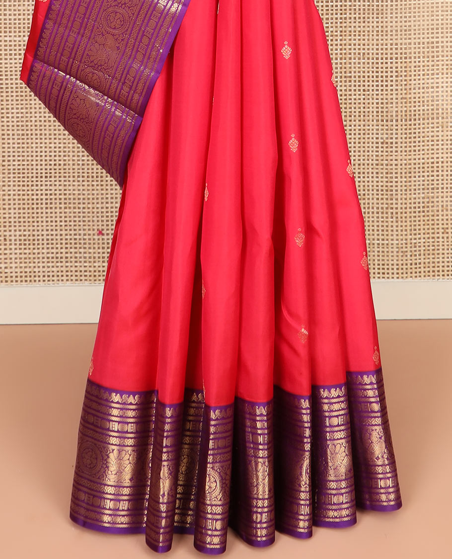 Red Vasundhara Silk Saree Adorned with Zari Buttas, Complemented by a Contrast Border of Thilakam Mokku, Banaras, Rudraksham, Kathir, Cross Neli, and Anna Chakram Designs, Pallu Decked Up with Jaal Designs, and Paired with a Contrast Blouse
