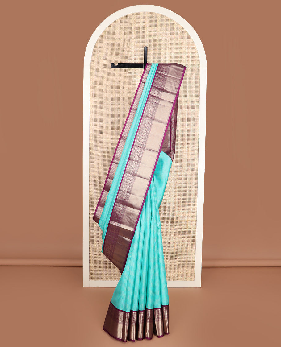 Blue micro-checked silk saree, contrast border of salngai, banaras, laddu kamalam, and annam motifs, and jaal design pallu