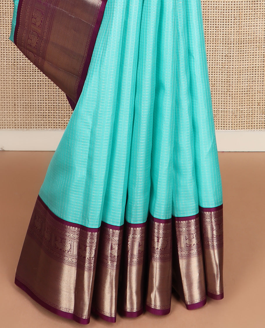 Blue micro-checked silk saree, contrast border of salngai, banaras, laddu kamalam, and annam motifs, and jaal design pallu