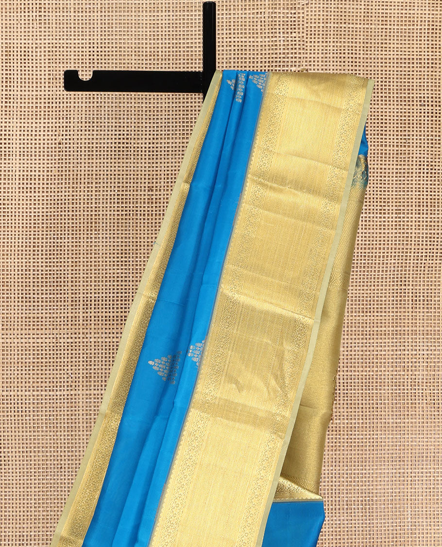 Blue Vasundhara Silk Saree, Decked Up with Zari Buttas All Over Its Body, Complemented by Contrast Border of Traditional Designs, Pallu of Floral Designs, and Paired with a Contrast Blouse
