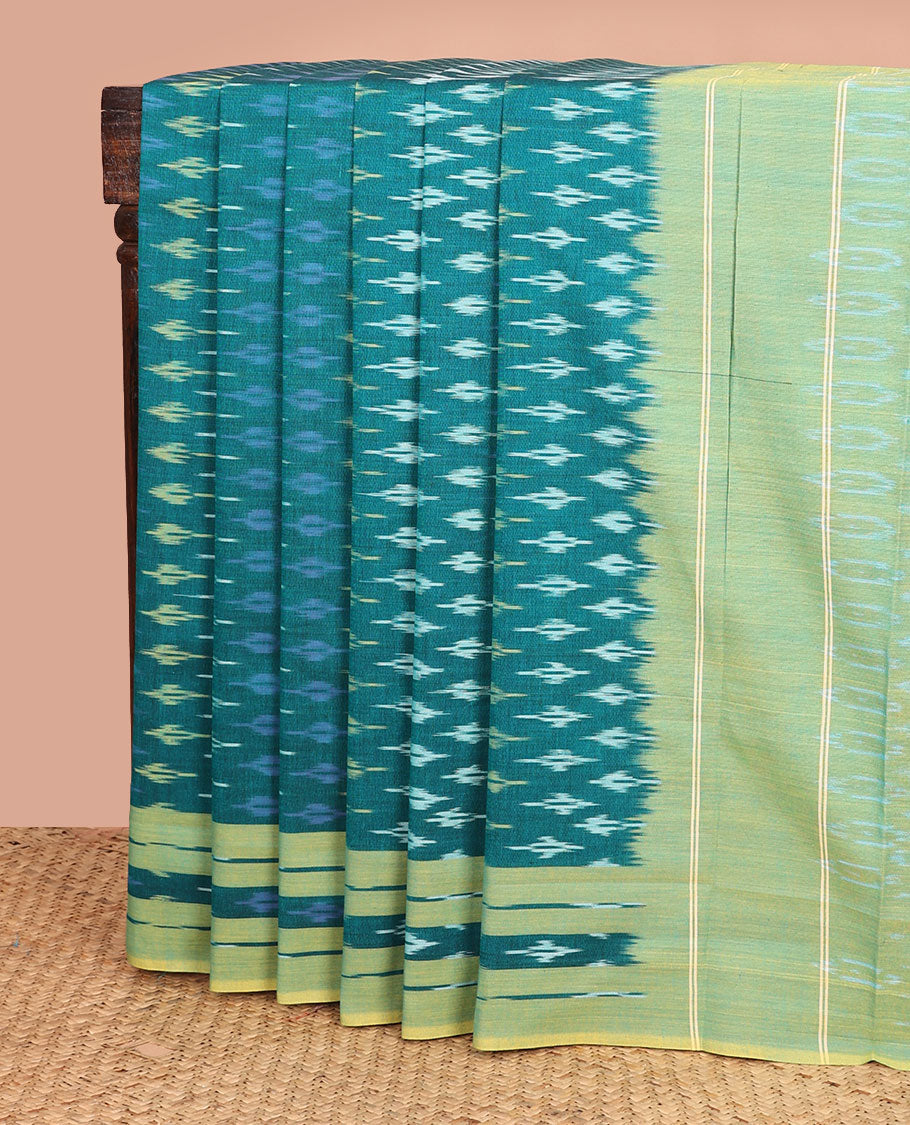 Teal blue buttas ikkat cotton saree, contrast ikkat woven border, and chevron striped pallu