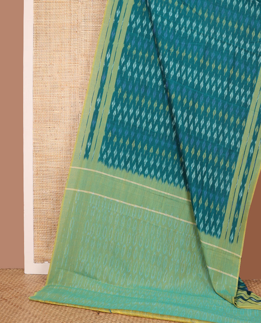 Teal blue buttas ikkat cotton saree, contrast ikkat woven border, and chevron striped pallu