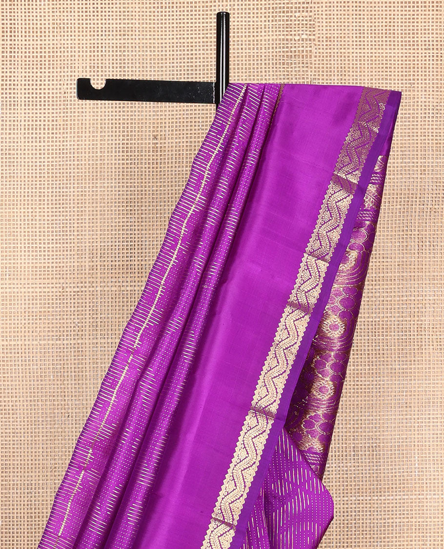 Purple zari buttas Kanchipuram silk saree, one-sided zari border of rekku, banaras, and neli designs, and floral design pallu