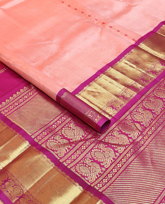 Peach Meena manga buttas kanchipuram silksaree, contrast one-sided korvai border & pallu of salngai,lavangam & mayil designs