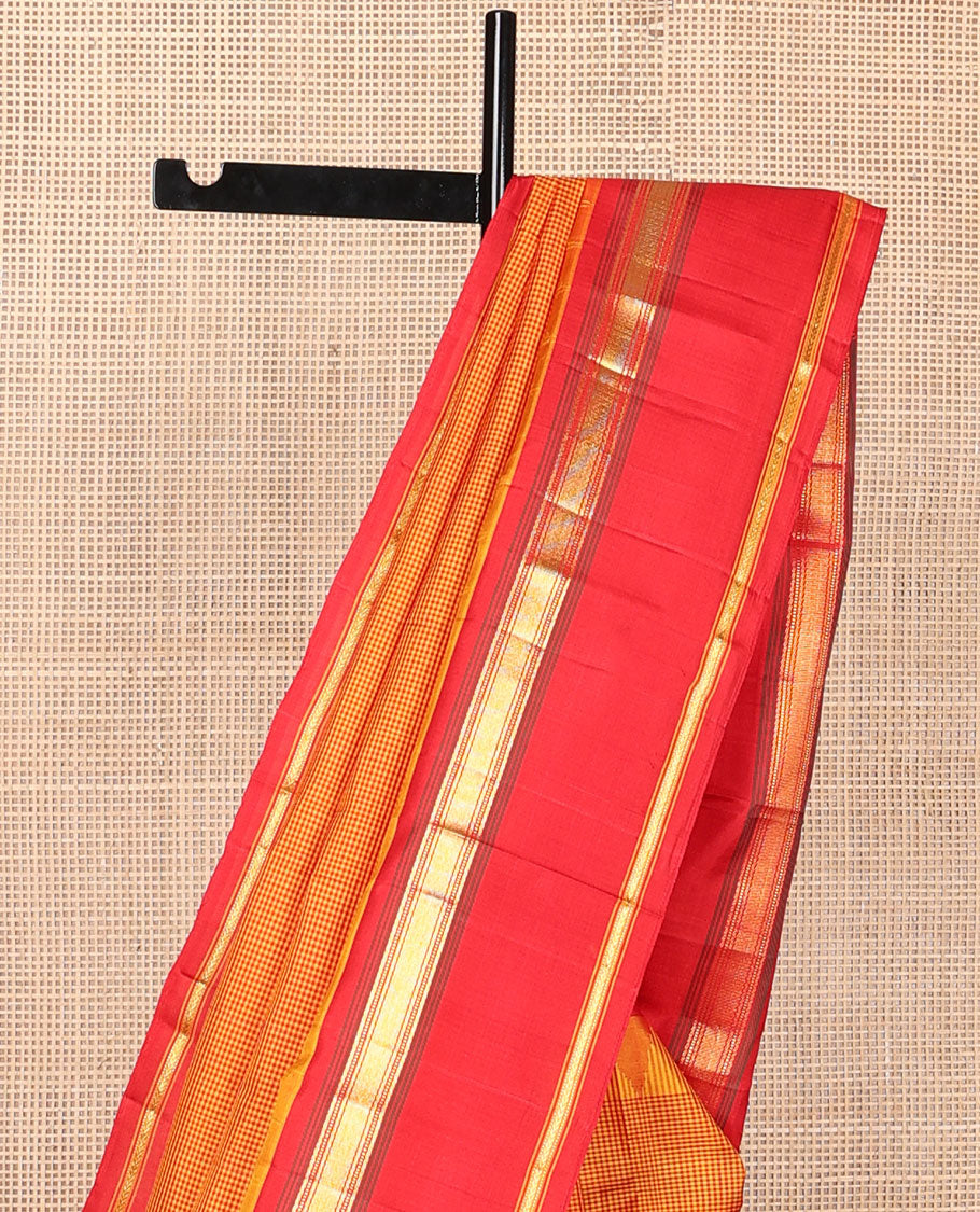 Orange micro-checked kanchipuram silk saree, contrast thazampoo rekku rettai pettu border of muthu & kathir designs & pillaiyar mokku pallu