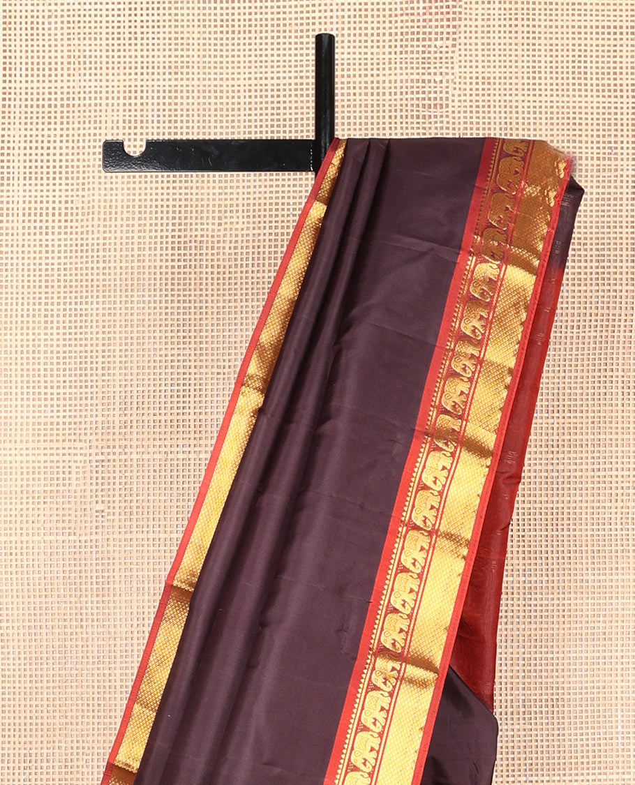 Chocolate brown plain silk saree, contrast border of rekku,banaras,mayil & mayil kann designs & zari striped pallu