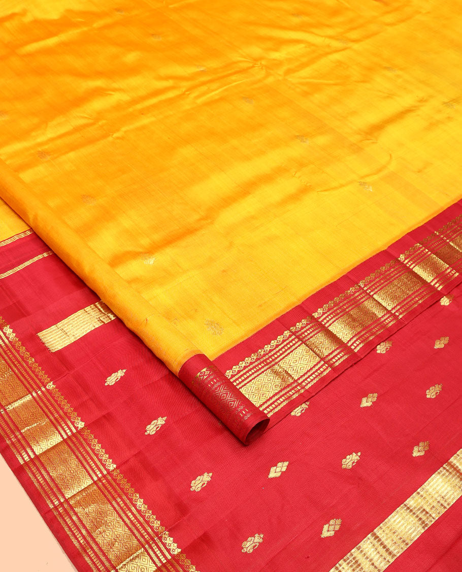 Yellow Kanchipuram Silk Saree, Woven with Zari Buttas All Over Its Body, Complemented by a Contrast One-Sided Korvai Border of Salngai, Banaras, Muthu, and Mayil Kann Designs, Pallu of Zari Designs, and Comes Without a Blouse