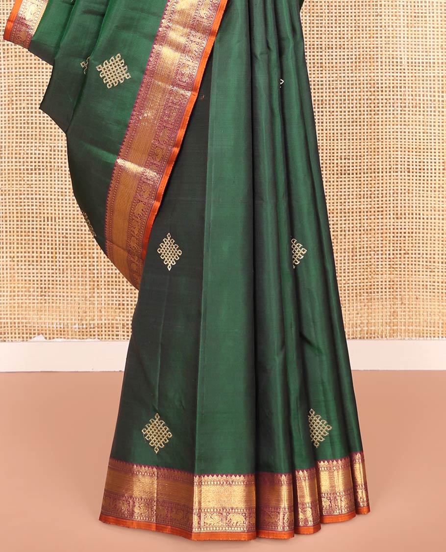Green Kanchipuram Soft Silk Saree Artfully Detailed with Kolam Buttas, Complemented by a Contrast Border of Thilakam Mokku, Muthu, Yaanai, and Mayil Designs, Zari-Rich Pallu of Mayil Kann Designs, and Paired with a Contrast Blouse