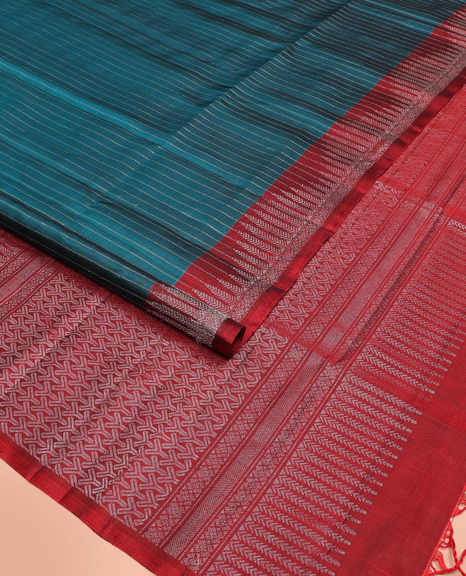 Blue muthu striped soft silk saree, contrast tree motifs border, and pallu of geometric patterns