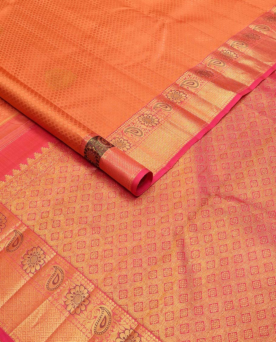 Orange floral design silk saree with contrast border of thilakam mokku, paun, manga design & argyle design pallu