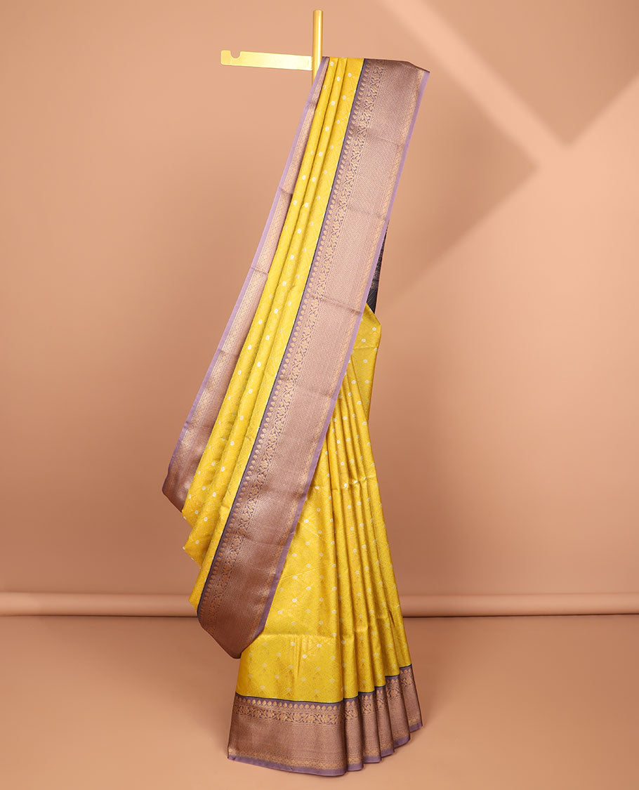 Yellow floral jaal design semi-soft silk saree with contrast intricate zari design border & striped zari design pallu