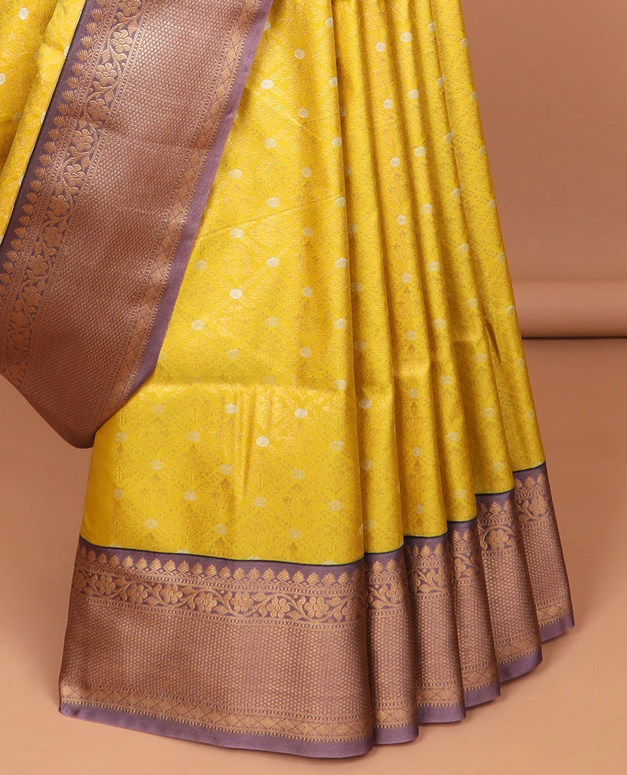 Yellow floral jaal design semi-soft silk saree with contrast intricate zari design border & striped zari design pallu