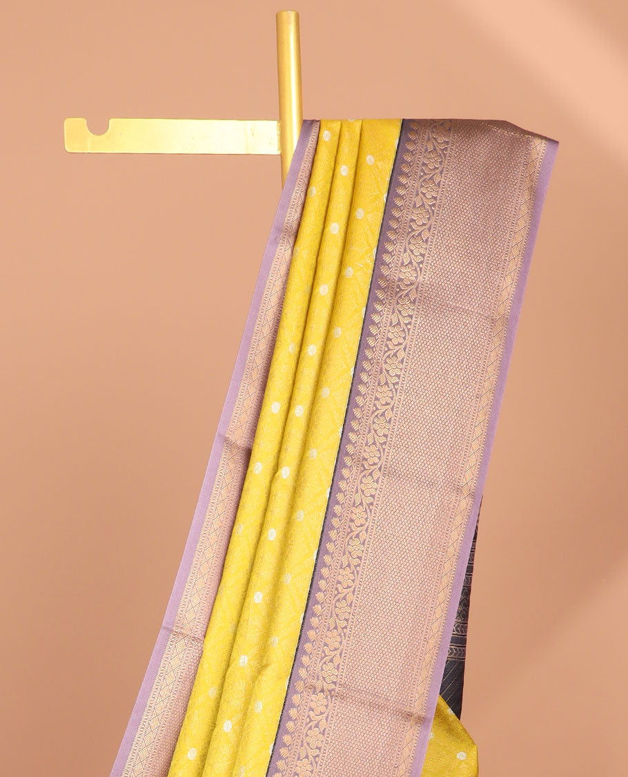 Yellow floral jaal design semi-soft silk saree with contrast intricate zari design border & striped zari design pallu