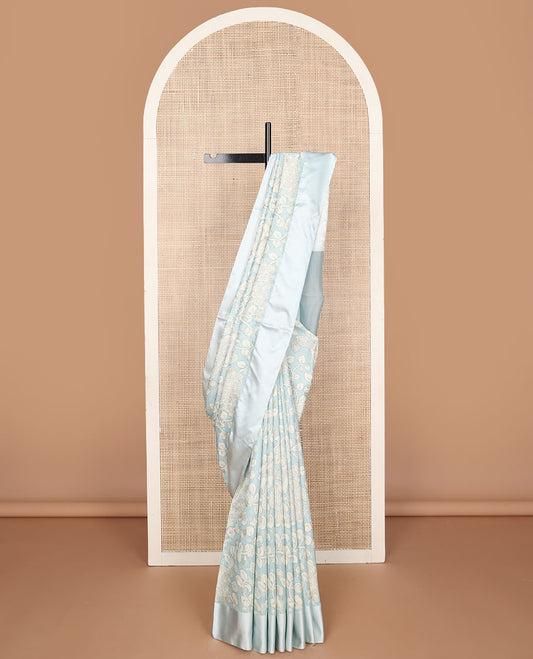 Blue kalamkari-style floral vine & peacock printed tussar saree with zari buttas, plain border & plain pallu