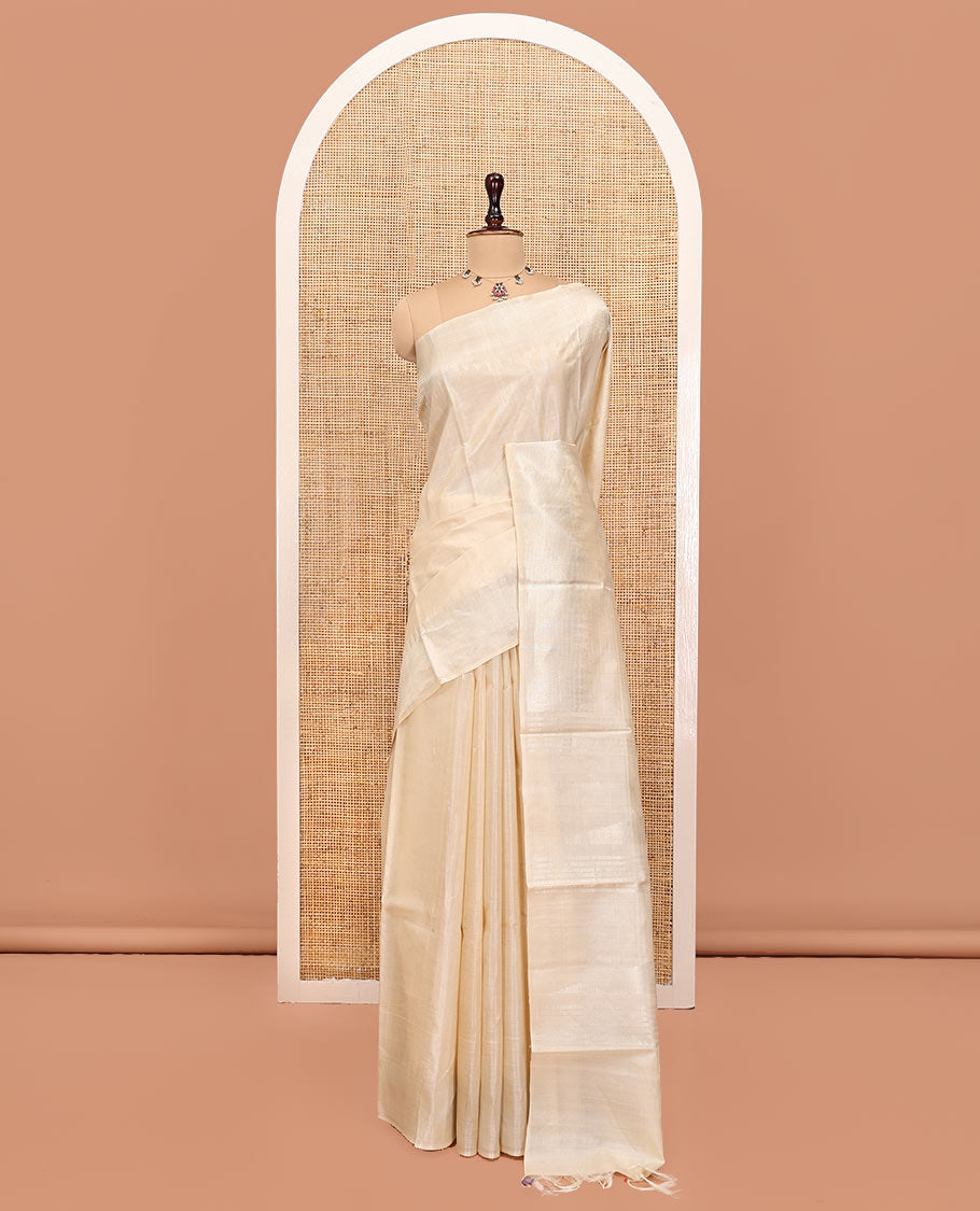 Cream Plain Tussar Silk Saree, a Gleaming Temple Zari Border, a Striped Pallu, and a Matching Blouse