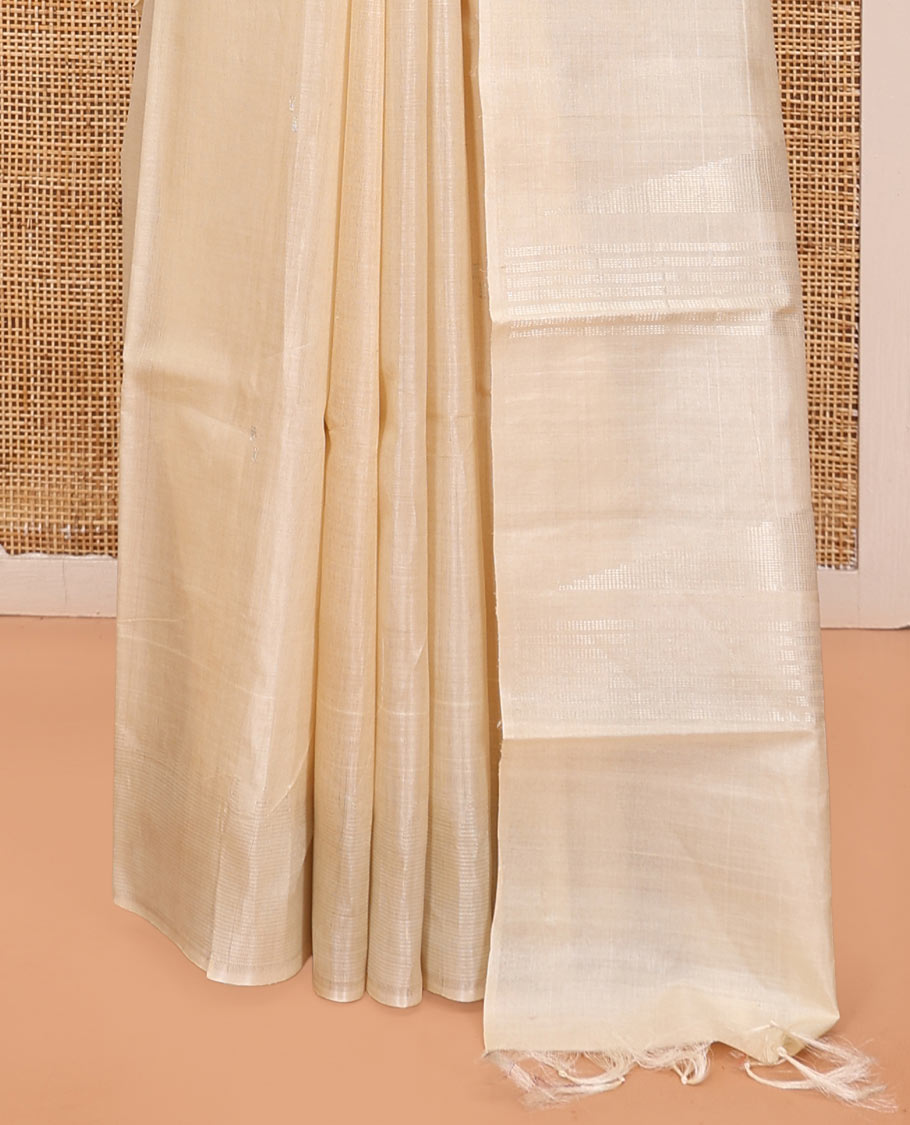 Cream Plain Tussar Silk Saree, a Gleaming Temple Zari Border, a Striped Pallu, and a Matching Blouse