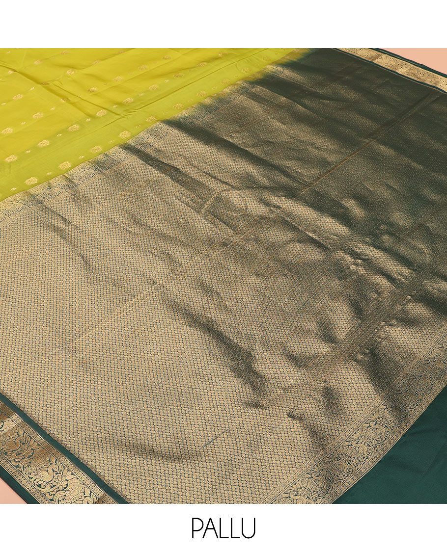 Green Vasundhara Lite-Silk Mix Saree Subtly Sparked with Zari Buttas, Complemented by a Contrast Border of Muthu, Rudraksham, and Mayil Designs, Pallu Elevated with Intricate Designs, and Paired with a Contrast Blouse