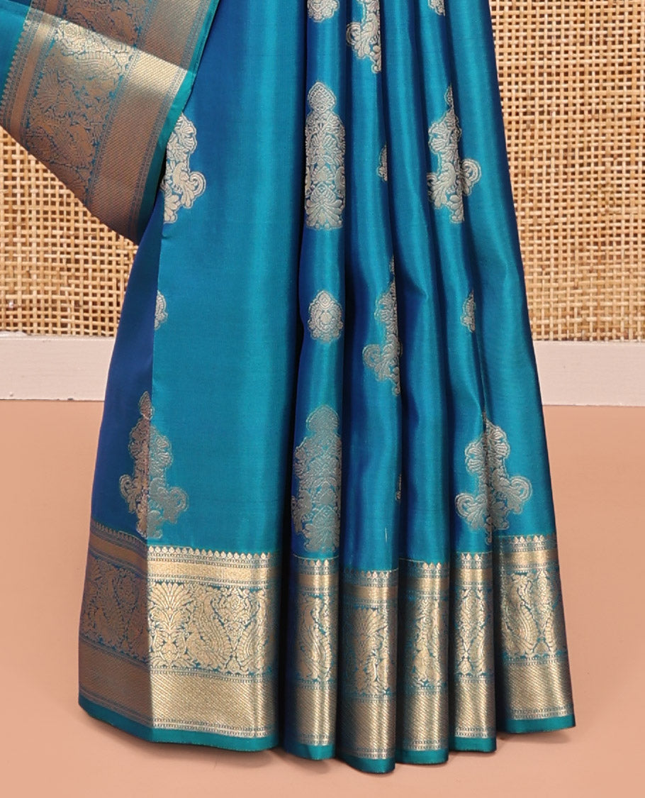 Blue Vasundhara Lite Silk Mix Saree, Elevated with Zari Buttas All Over Its Body, Highlighted by Zari Border of Thilakam Mokku, Mayil Kann, And Mayil Designs, Grand Pallu and Paired with a Matching Blouse