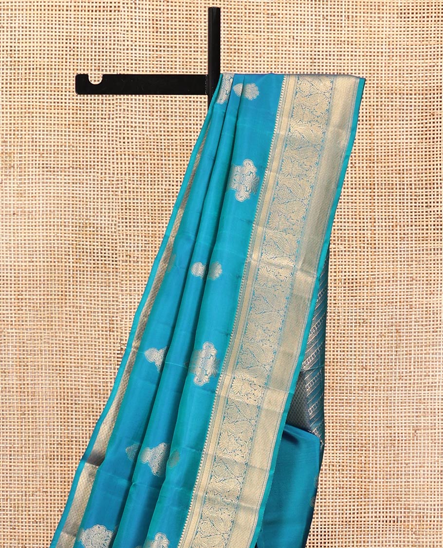 Blue Vasundhara Lite Silk Mix Saree, Elevated with Zari Buttas All Over Its Body, Highlighted by Zari Border of Thilakam Mokku, Mayil Kann, And Mayil Designs, Grand Pallu and Paired with a Matching Blouse