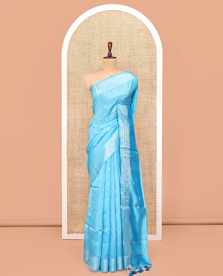 Blue Banana Pith Saree, Subtly Sparkled with Square Buttas All Over Its Body, Sparsely Woven Temple Border of Rudraksham Designs, Pallu of Buttas, and Paired with a Matching Blouse