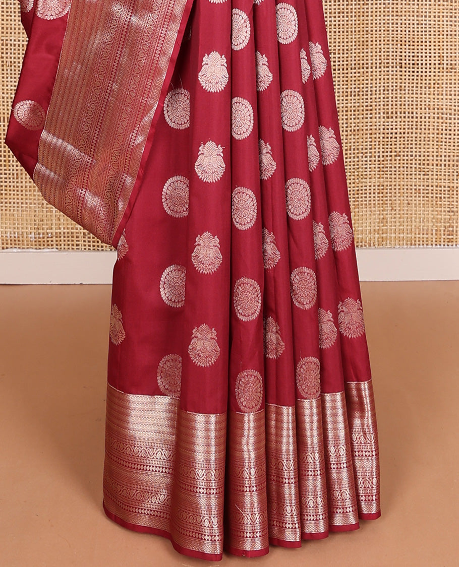 Maroon iruthalai pakshi and chakram Vasundhara silk mix, traditional motifs zari woven border, and vanki pallu