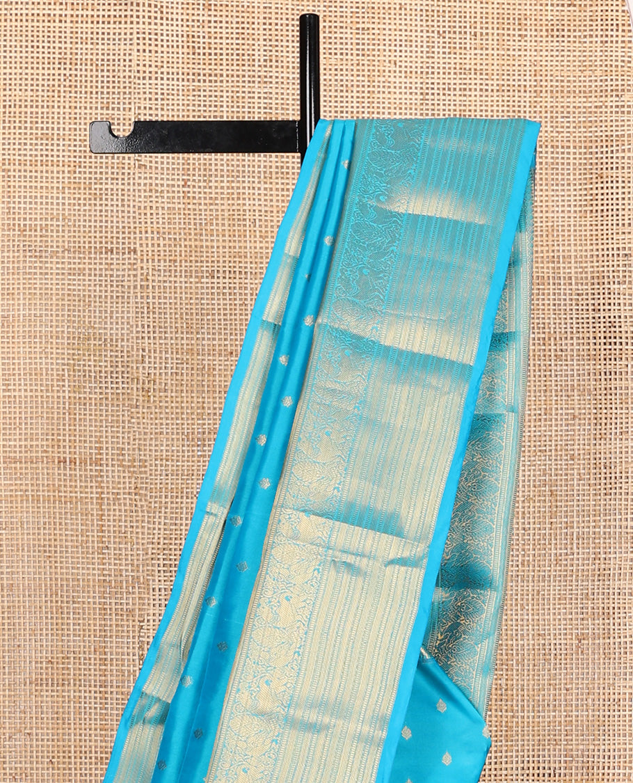 Blue zari buttas Vasundhara silk mix, traditional zari border of mayil, yaali, and muthu designs and paiyaadi kattam pallu