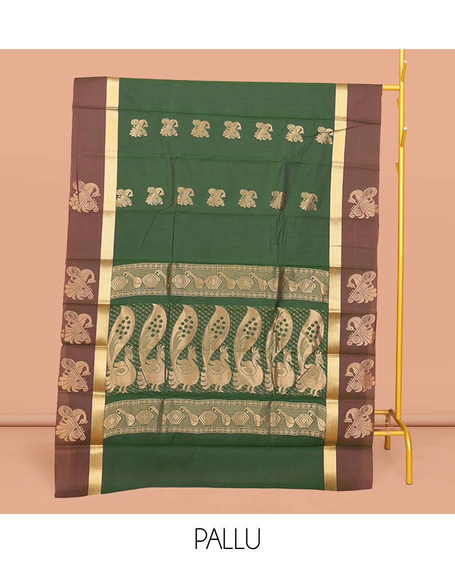 Green Semi-Silk Cotton Saree, Embellished with Zari Buttas All Over Its Body, Complemented by a Contrast Border of Peacock and Veena Designs, Pallu of Peacock Designs, and Paired with a Matching Blouse