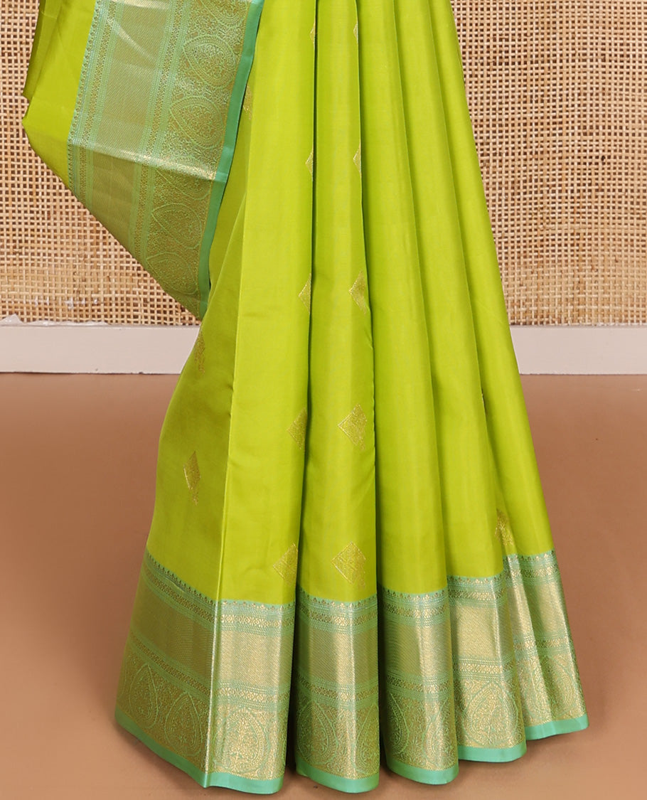 Parrot green zari buttas Vasundhara silk mix, contrast traditional zari border of thilakam motifs, and jaal pallu