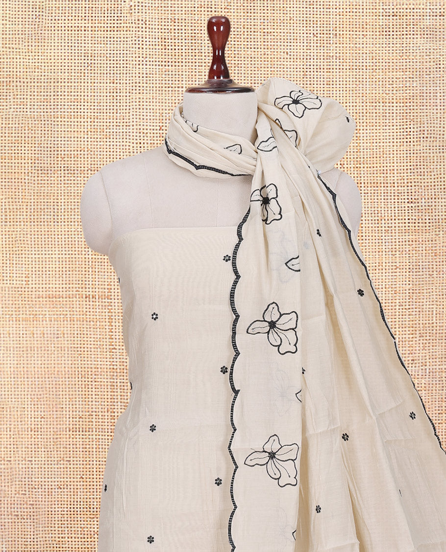 Cream Mul Chanderi Material Churidar Features Floral Thread Embroidered Top, a Matching Bottom, and an Scallop Embroidered Dupatta