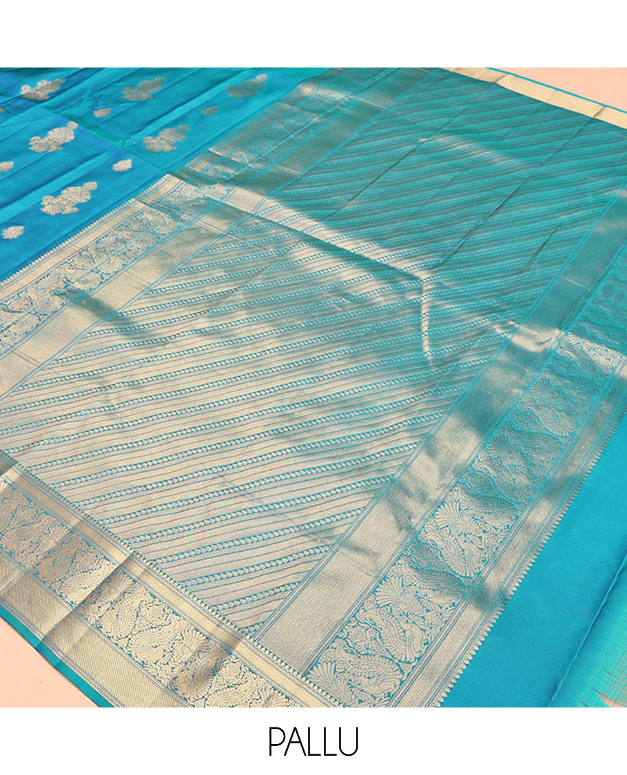 Blue Vasundhara Lite Silk Mix Saree, Elevated with Zari Buttas All Over Its Body, Highlighted by Zari Border of Thilakam Mokku, Mayil Kann, And Mayil Designs, Grand Pallu and Paired with a Matching Blouse