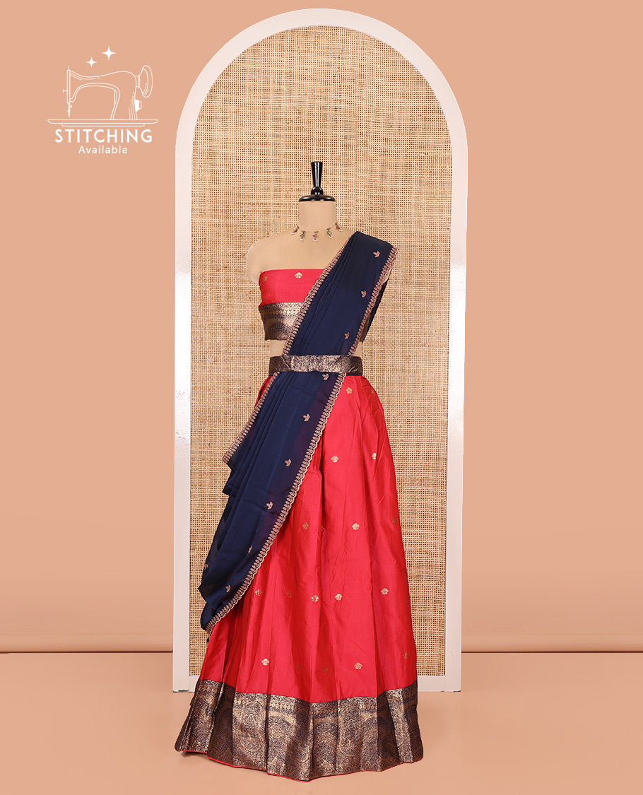 Pink and Blue Semi-Banarasi Half-Saree, Elegantly Woven with Zari Buttas on Its Skirt, Complemented by a Contrast Geometric Patterns Zari Woven Border, Paired with a Matching Blouse, and a Contrast Satin Georgette Embroidered Scallop Dhavani