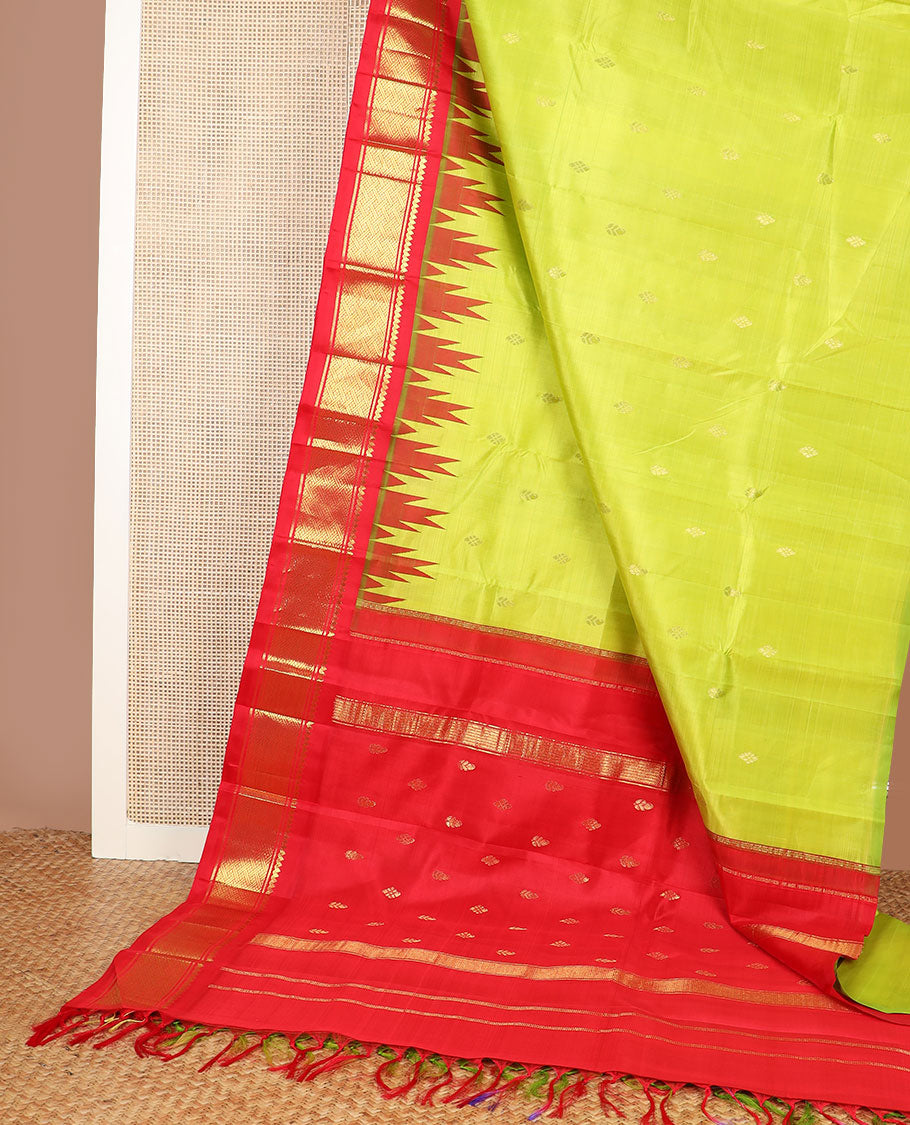Green zari buttas Kanchipuram silk saree, contrast one-sided thazampoo rekku border of thilakam mokku & paayadi kann & zari design pallu